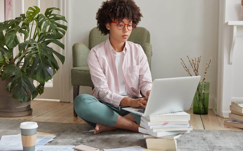 black-businesswoman-keyboards-on-laptop-computer-RXTPFFR.jpg